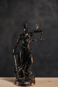 pexels photo 8112193 Elegant bronze Lady Justice statuette symbolizing law and justice.